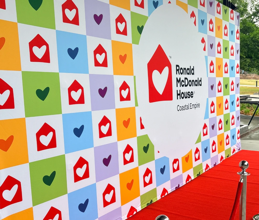 Ronald McDonald House Coastal Empire backdrop and red carpet at an event