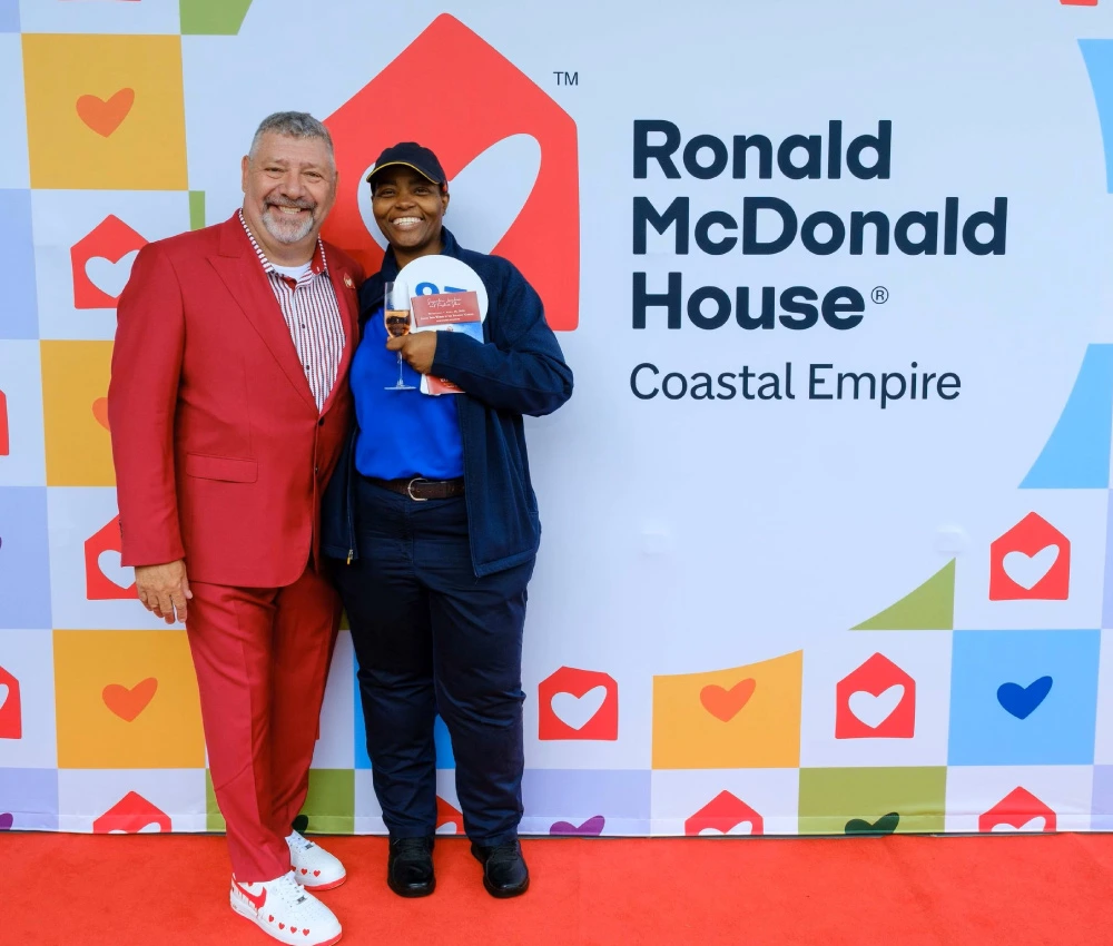 McDonald's manager with our CEO on red carpet at Ronald McDonald House Coastal Empire event